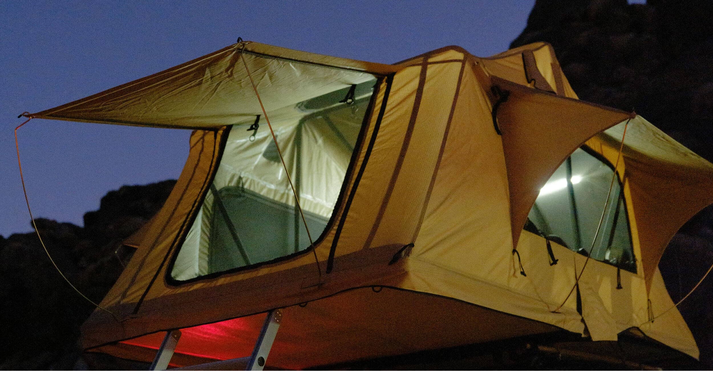 A Top Dog rooftop tent set up in the outdoors